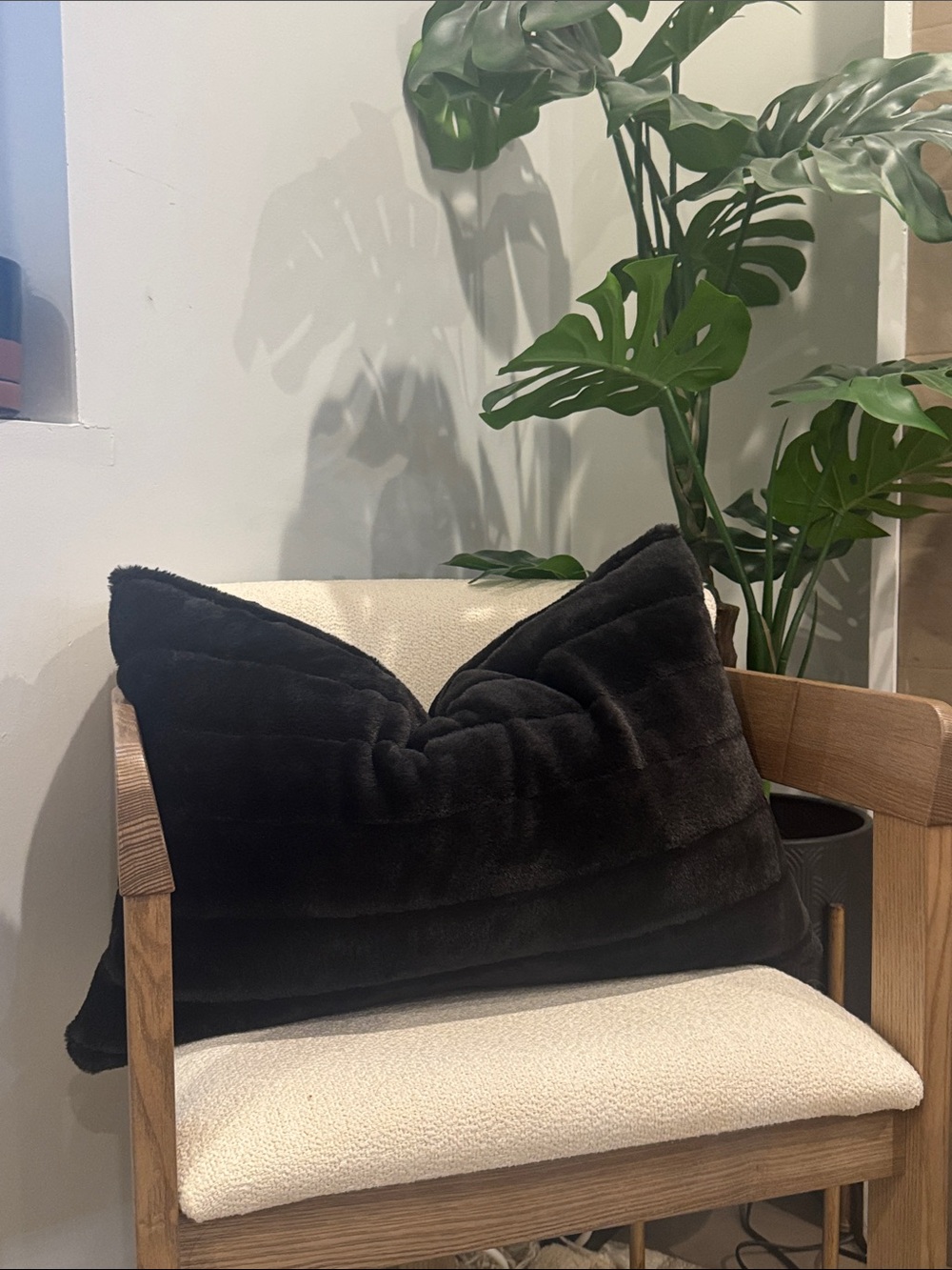 Black luxuriously soft faux fur lumbar pillow.